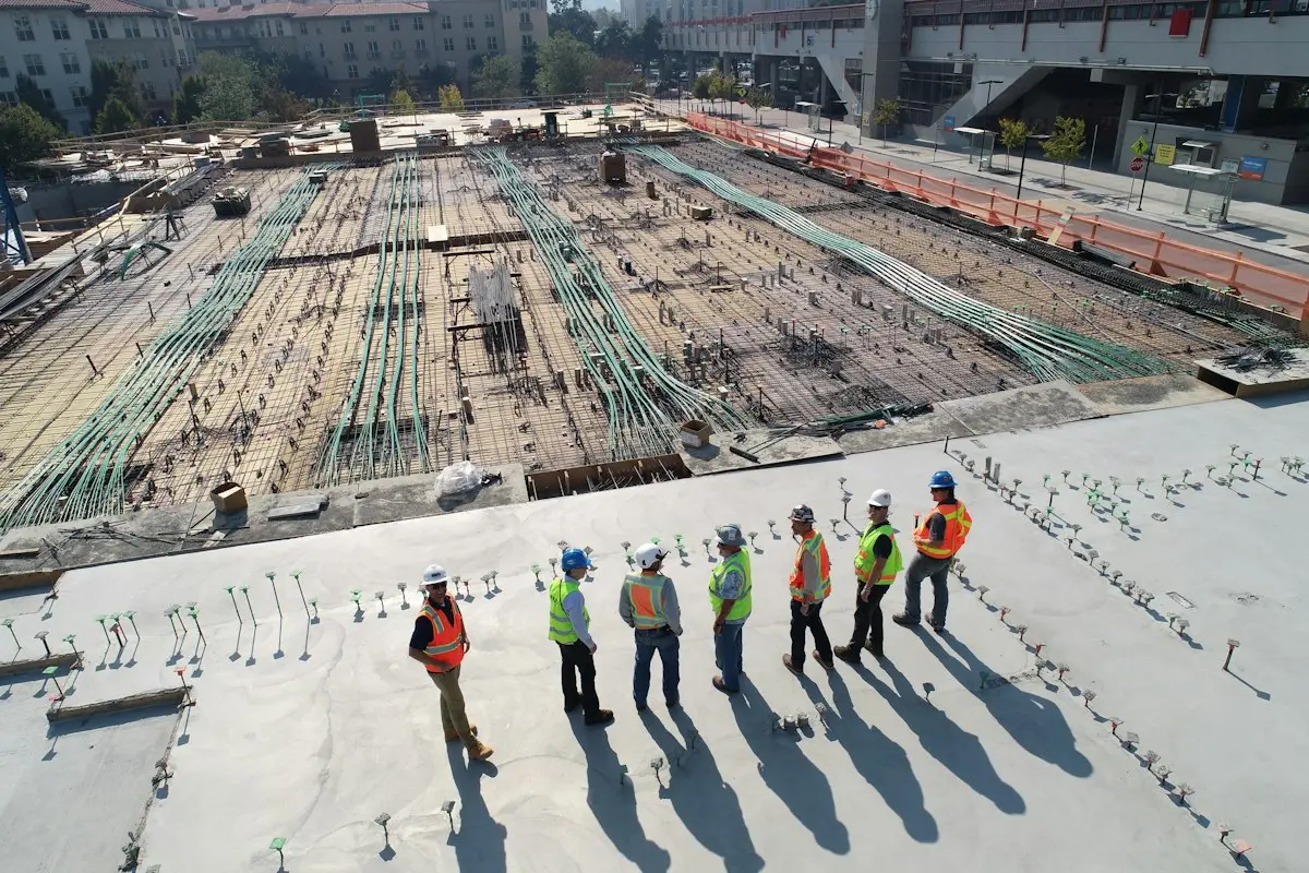 Site team reviewing work on a construction slab